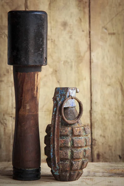 Grenade on old wood for background and texture — Stock Photo, Image