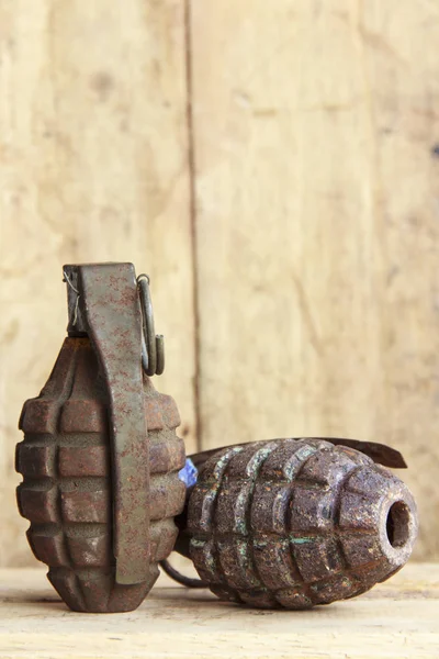 Grenade on old wood for background and texture — Stock Photo, Image