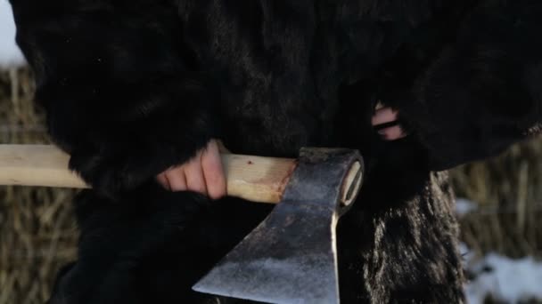 Portrait of a northern boy close up with an ax. Teen Boy in winter coat with a hatchet. Siberian boy with a stern face. — Stock Video