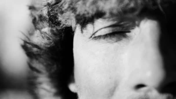 Portrait of a man playing a harp(black and white image). The bearded shaman plays the harmonica drymba(black and white image). Face close up with a musical instrument Jew's Harp (Sound file). — Stock Video