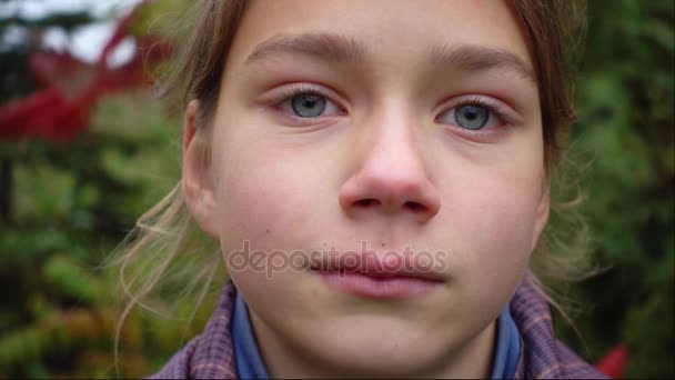 Portrait of a boy who is punched on the face slow motion. Slow movement of the fist in the face of 100 frames per second. — Stock Video