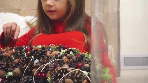 Little Girl Makes Christmas Wreath Holiday Child Adorned Wreath Christmas — Stock Video