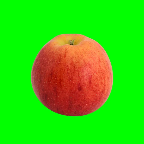 Red ripe apple isolated on green background — Stock Photo, Image