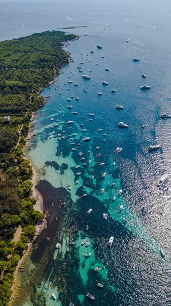 Aerial drone shot view of coast line of Ile Sainte Marguerite and yachts in mediterranean sea, south France — Stock Photo, Image