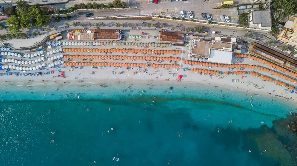 Aerial drone shot view of Monterosso beach filled with parasol in summer time — Stock Photo, Image