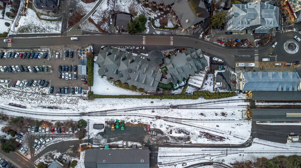 Flat lay drone shot of train station of Chamonix-mont-blanc city at the foot of Mont Blanc, French Alps