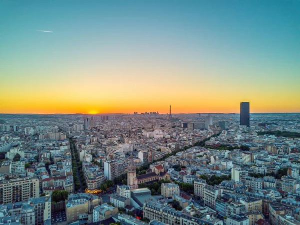 Aerial drone shot sunset view of Eiffel tower and Tour Montparnasse from Paris 14 arrondissement — стокове фото