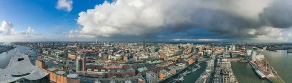 Aerial drone panoramic view of port of Hamburg from above before sunset with dramatic stormy clouds — Stock Photo, Image