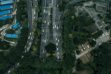Aerial drone shot of flyover with heavy traffic in foggy gloomy weather in Chongqing, Southwest China clipart