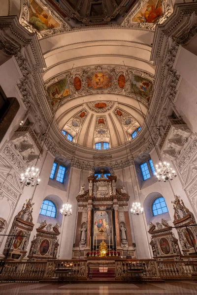 Ultrawide view of dome and ceiling with low light inside Salzburg Cathedral