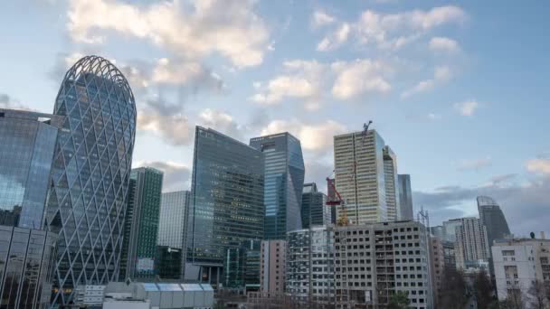 Dec 24, 2019 - Paris, France: Timelapse of La Defense, skyscraper complex in Paris financial area, view from Courbevoie side during sunset hour till evening — Stock Video