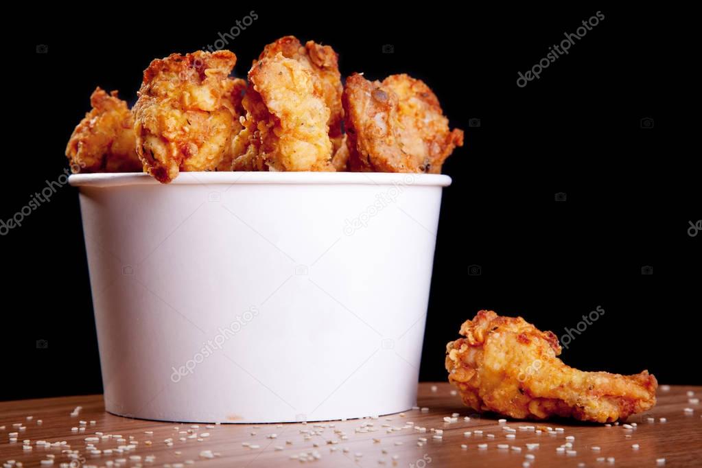Chicken wings barbeque in white bucket