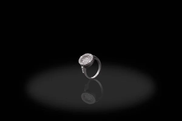 Silver precious ring female with diamonds on black background. Good material for design jewelery. — Stock Photo, Image