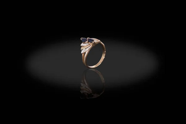 Yello gold precious ring female with diamonds and sapphire on black background. Good material for design jewelery. — Stock Photo, Image
