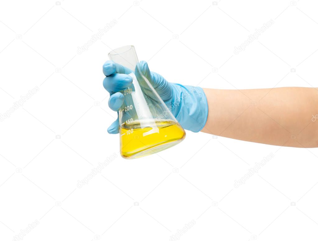 Female hand of a medic in safe blue rubber glove in which the liquid is a yellow vaccine, the development of drugs. Isolate on a white background on white background isolate.