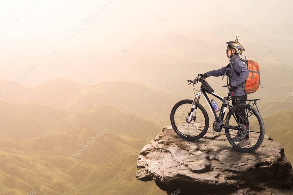 Cyclist on top of hill 