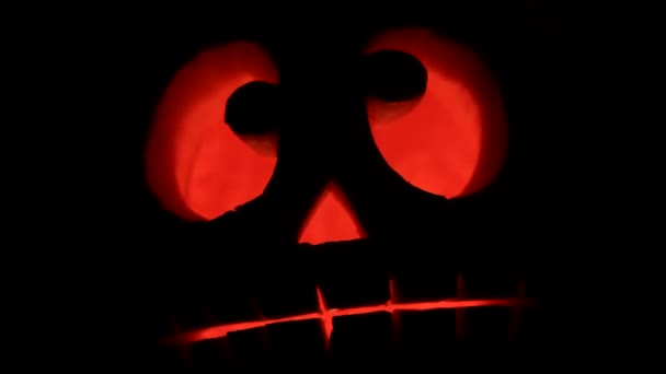 Pumpkin Jack o'latern burning in the darkness — Stock Video