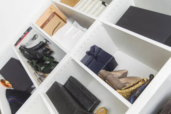 Modern walk in closet with luxury shoes and bags