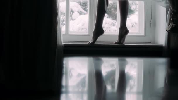 Girl Walks Barefoot Windowsill Winter Day — Stock Video