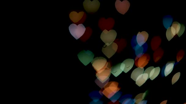情人节背景 环绕着抽象多彩的心和粒子 用阿尔法夹子隔开黑色背景 设计动画贺卡和横幅 — 图库视频影像
