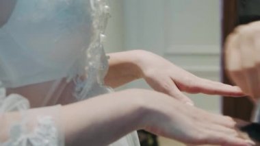 girl's hands powder makeup brush with a brush. Make-up artist work with a client