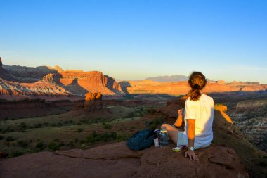 female tourist enjoying the sunset in capitol reef national park