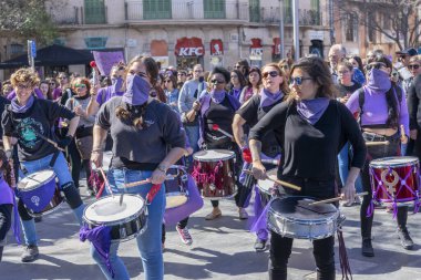 Palma de Mallorca, Spain - March 08, 2020: International Women's Day. Drummer women band parade in a feminist protest.