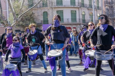 Palma de Mallorca, Spain - March 08, 2020: International Women's Day. Drummer women band parade in a feminist protest.