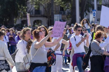 Palma de Mallorca, Spain - March 08, 2020: International Women's Day. Young crowd in the feminist protest.