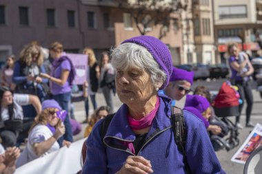 Palma de Mallorca, Spain - March 08, 2020: International Women's Day. Old woman portrait in the spanish feminist protest.