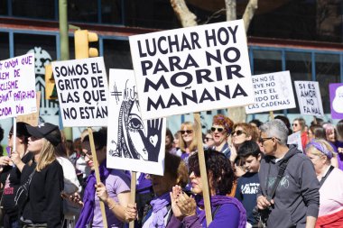 Palma de Mallorca, Spain - March 08, 2020: International Women's Day. March of the 8m feminist protest in the downtown, crowd with several banners in spanish.