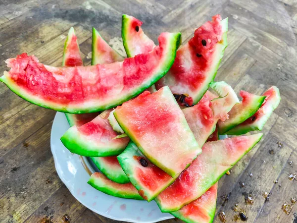 Green Peel Eaten Watermelon Lies White Plate - Stock-foto