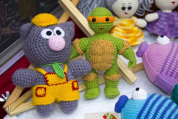 Toys made of knitted threads. Colourful handmade crochet animals. Soft toys.Children\'s toy. Crochet pattern. Handicraft manufacturing.