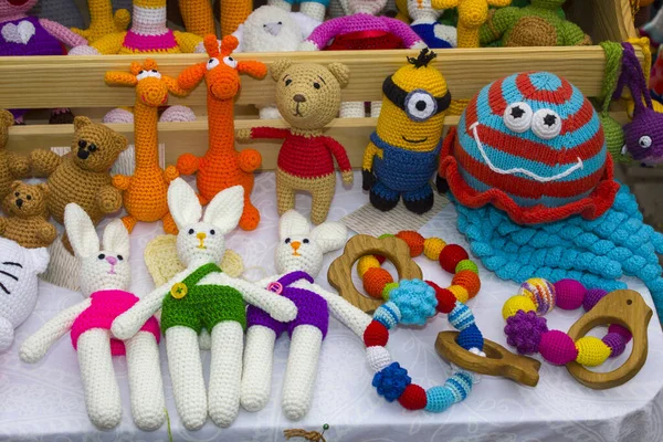 Toys made of knitted threads. Colourful handmade crochet animals. Soft toys.Children\'s toy. Crochet pattern. Handicraft manufacturing.