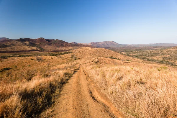 Trilha de estrada de terra deserto — Fotografia de Stock