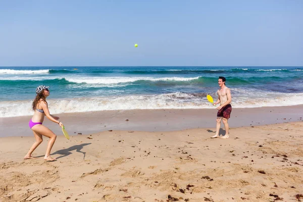 Boy Girl Beach Ocean Bat Playtime — стоковое фото