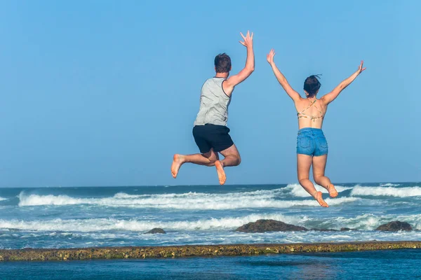 Girl Boy Jump Leap Beach Ocean Tidal Pool — Stock Photo, Image