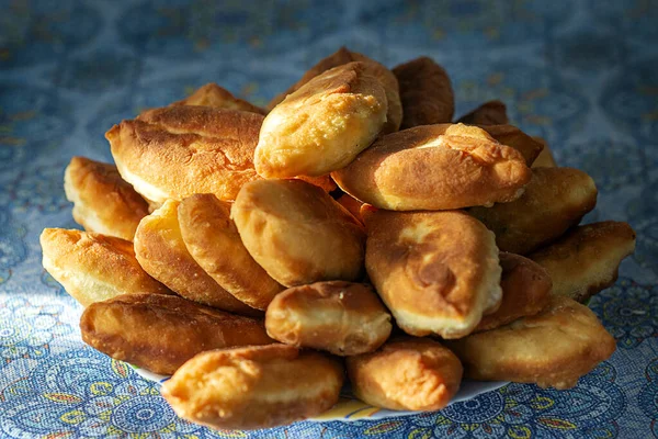 Lot Fried Pies Plate Background Blue Tablecloth Stock Photo