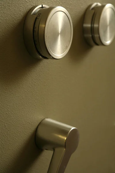 door of a safe is opened with shims for the combination lock