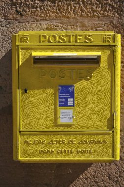 old yellow mailbox in the city clipart