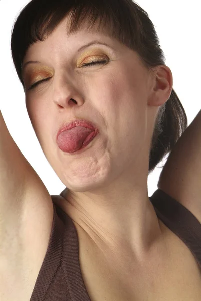 Young Dark Haired Woman Shows Tongue — Stock Photo, Image