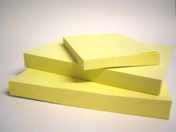 yellow paper origami letter on a black background