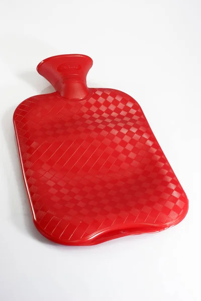 在白色背景上隔绝的红色塑料暖器 — 图库照片