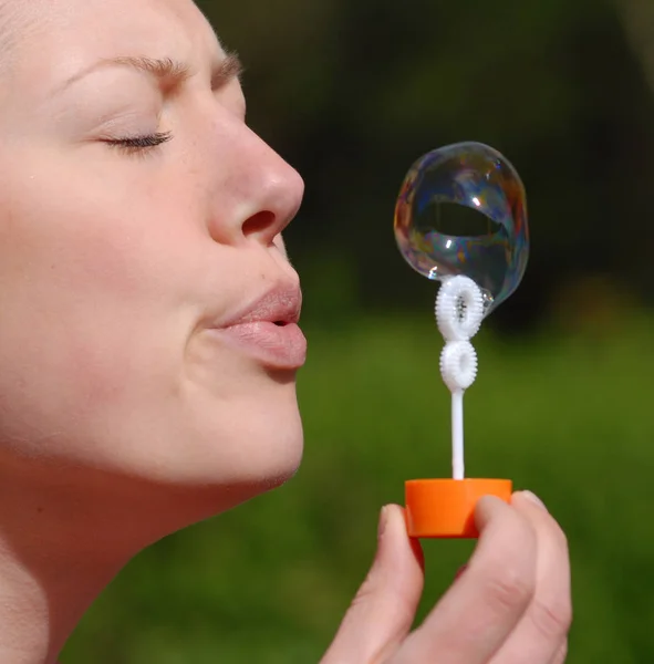 Young Woman Making Soap Bubbles — Stock Photo, Image