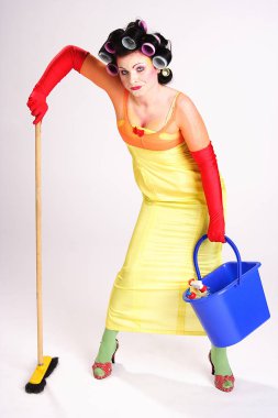 young woman in a yellow dress with a broom clipart