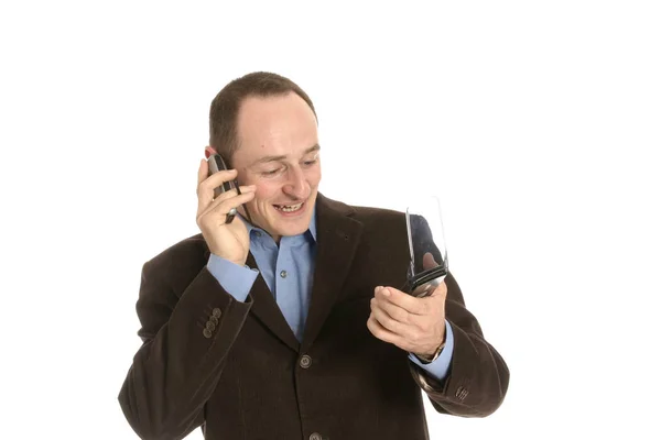 ホワイトに隔離された携帯電話を持つビジネスマン — ストック写真