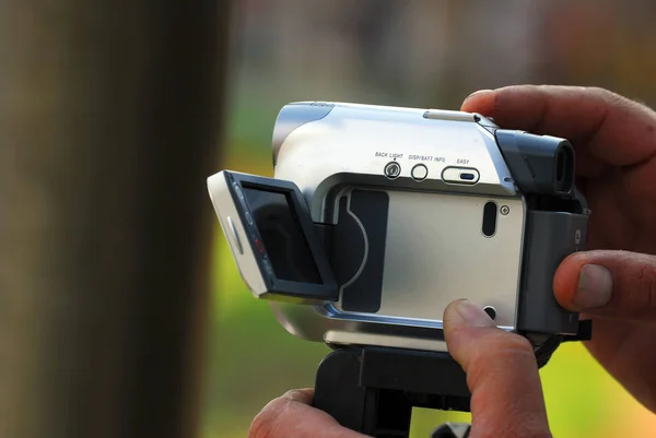 Close Hand Holding Video Camera Blurred Background — Stock Photo, Image