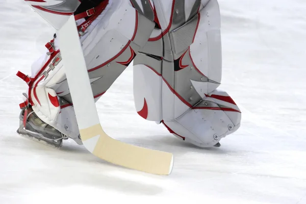 ice hockey stick on snow