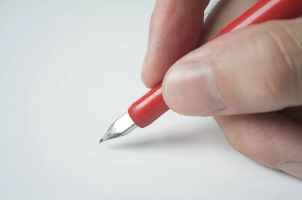 Hand Met Pen Witte Achtergrond — Stockfoto