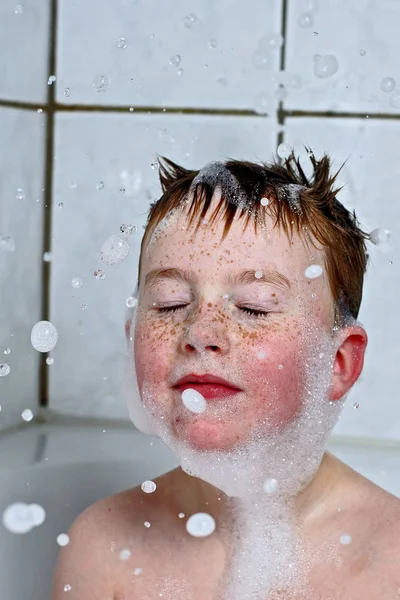 young woman washing face in the bathroom